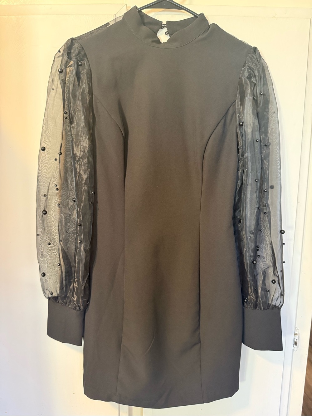 Boutique brand. Elegant Black Dress with Sheer Beaded Sleeves with Cut Out Back